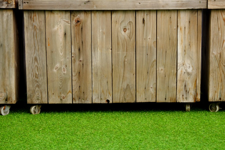 wood jardiniere with green grassの写真素材