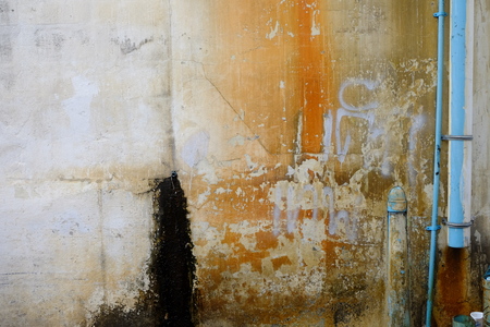 dirty of street wall with pipe textureの写真素材