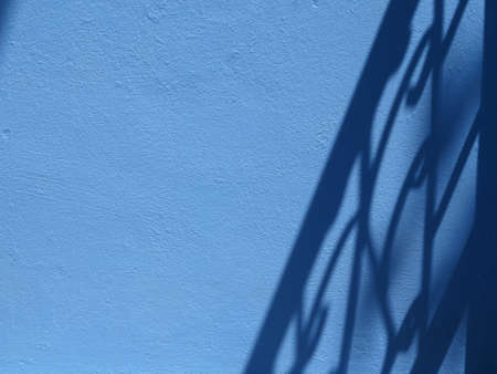 shadow on blue wallの写真素材