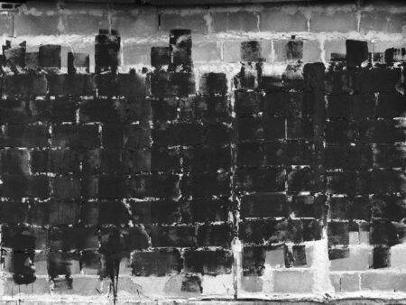 black paint on cement block wall backgroundの写真素材