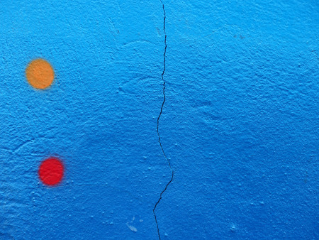 blue paint wall with crack textureの写真素材