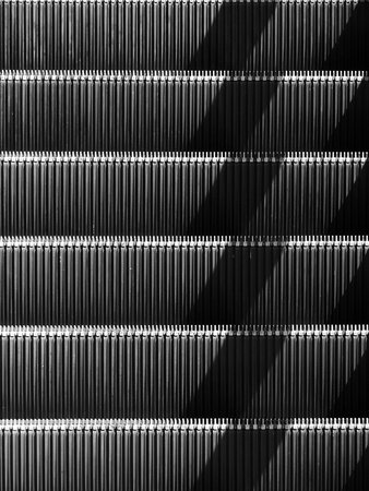 black and white escalator with light and shadowの写真素材