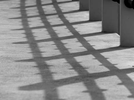 black and white shadow on bridge floorの写真素材