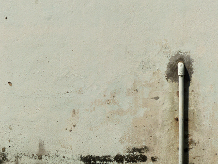 dirty wall with pipeの写真素材