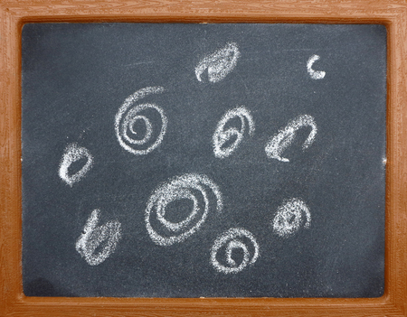 Drawing on a blackboardの写真素材