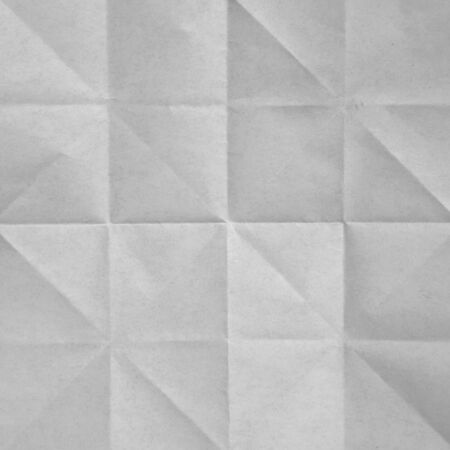 White sheet of paper folded textureの写真素材