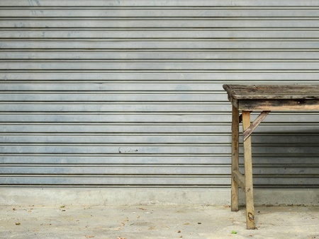 old wood table with street wallの写真素材