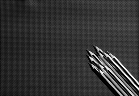 Wood pencil on black leatherの写真素材