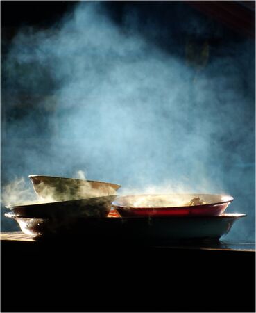 plate of hot food with smoke and morning lightの写真素材