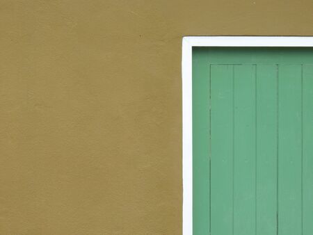 minimal style green wood door with brown wallの写真素材