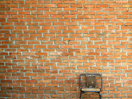 old brick wall with vintage chairの写真素材