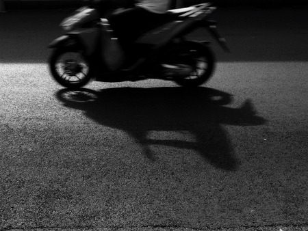 blur motorcycle running on the road black and white styleの写真素材