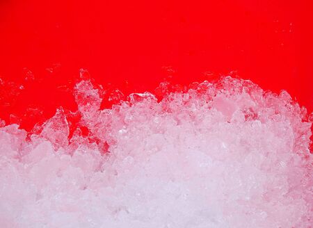 Ice in red plastic bucketの写真素材