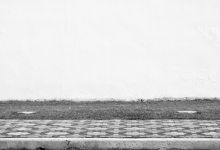 wall and footpath in streetの写真素材