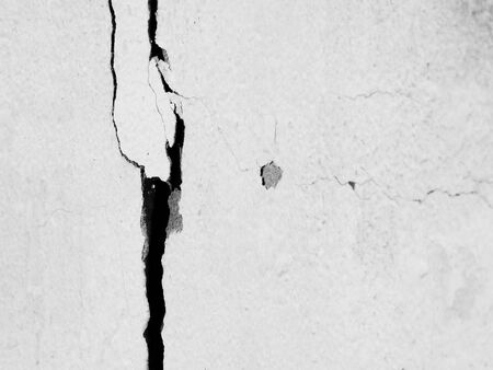 white wall with crack texture backgroundの写真素材