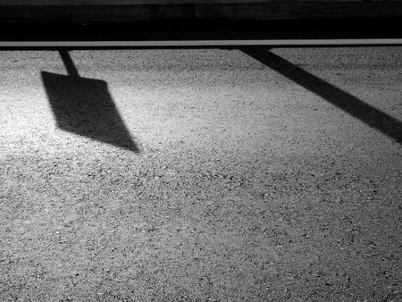 asphalt road with light and shadowの写真素材