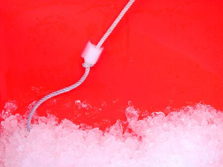 Ice in red plastic bucket