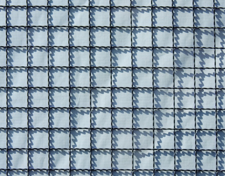steel wire mesh with shadow on plastic canvasの写真素材