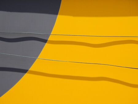 shape of shadow on color wall with wireの写真素材