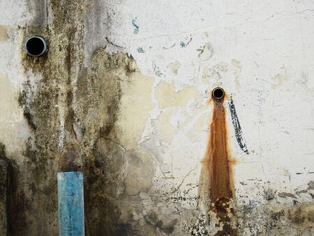 old dirty wall with pipeの写真素材