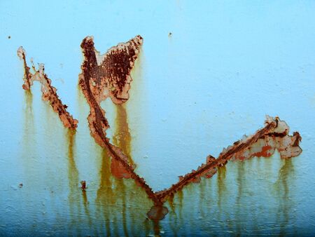 stain of rust on blue metal textureの写真素材