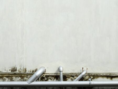 old concrete wall with pipeの写真素材