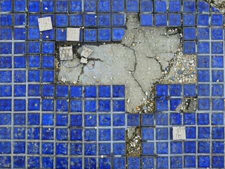 crack blue ceramic tile floor textureの写真素材
