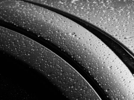drops of water on the car after rainの写真素材