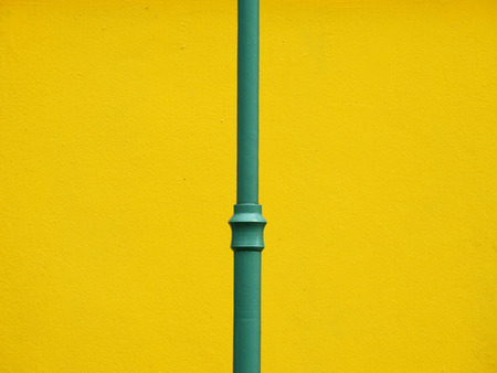 green lamp post with yellow wall background minimalism styleの写真素材