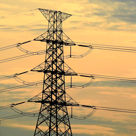 silhouette of high voltage pole in sunset time