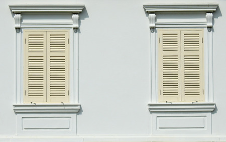 old vintage wood window on white wallの写真素材