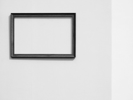 Empty wooden frame on the wall, black and white styleの写真素材