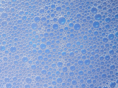 bubble foam on blue water texture
