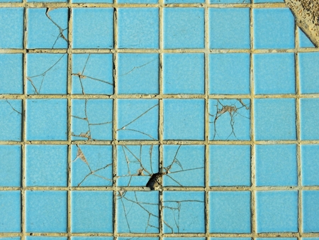 old blue ceramic tile floor with crack textureの写真素材