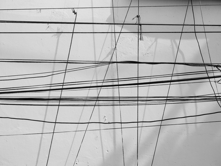 wire with shadow on white wallの写真素材