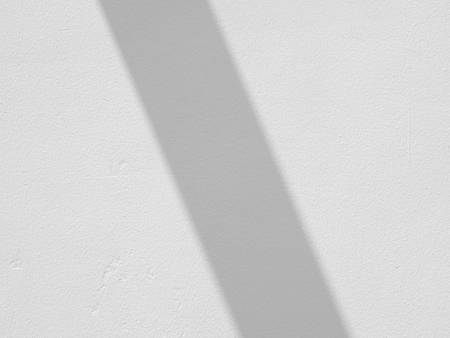 white wall with shadow texture backgroundの写真素材