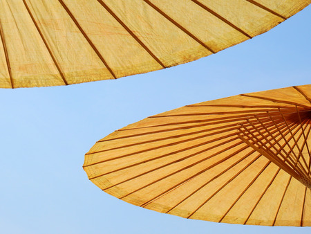 under of open umbrella with blue sky backgroundの写真素材