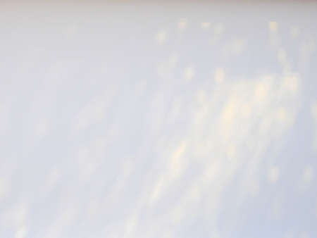 light and shadow bokeh on white wall