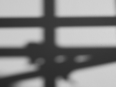 Shadow of scaffolding on the white wallの写真素材