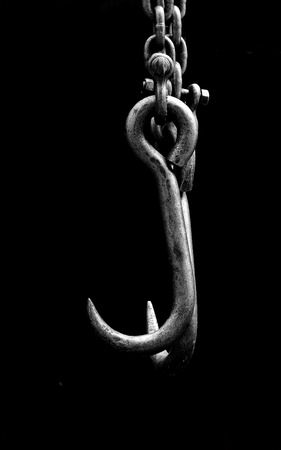 old metall chain hook on black backgroundの写真素材