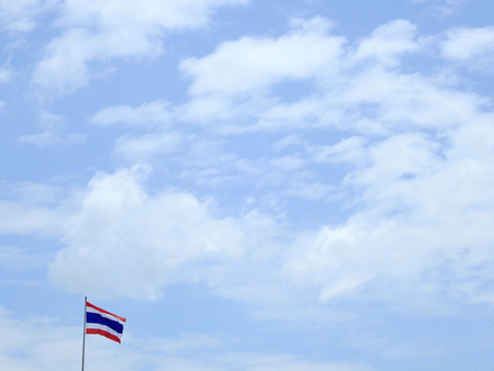 Thai flag with blue sky and cloud backgroundの写真素材