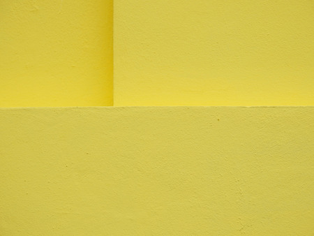 yellow paint wall texture backgroundの写真素材