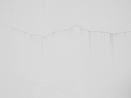 Cracked concrete wall backgroundの写真素材