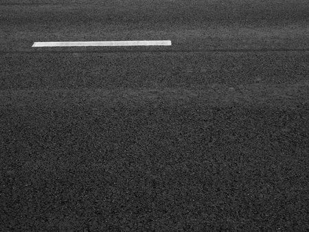 asphalt road with white line textureの写真素材