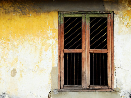 vintage window on wall of old home thai styleの写真素材