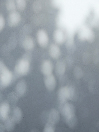 shadow on white wall, light and bokehの写真素材