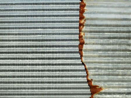 Old damage rusty zinc plate wallの写真素材