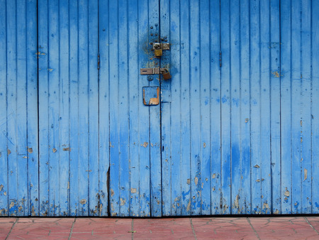 traditional blue wood door of old homeの写真素材