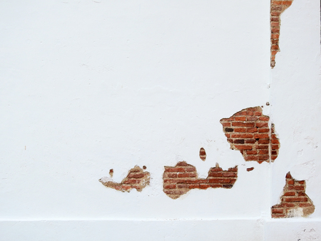 crack concrete white wall with brickの写真素材