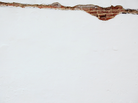 crack concrete white wall with brickの写真素材